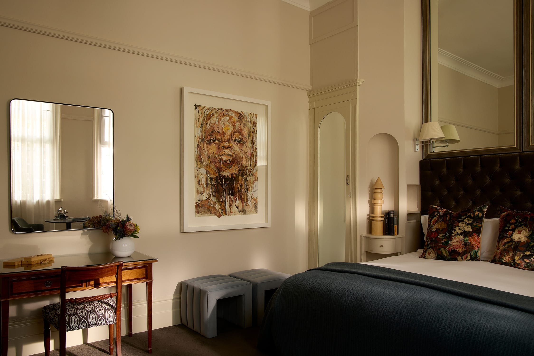 Soft morning light across the bed and muted interior tones