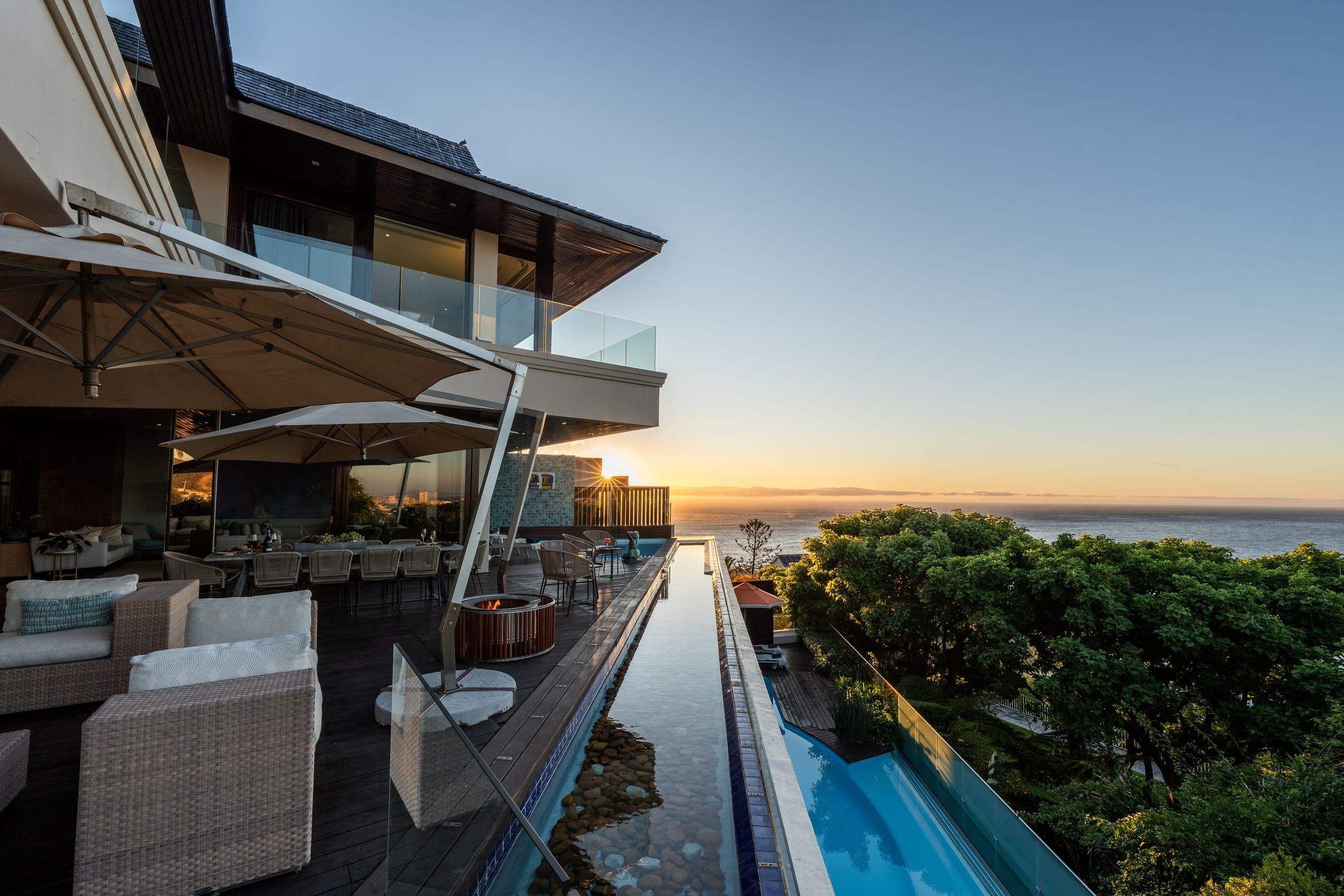 Villa One with a private infinity pool above Bantry Bay at twilight