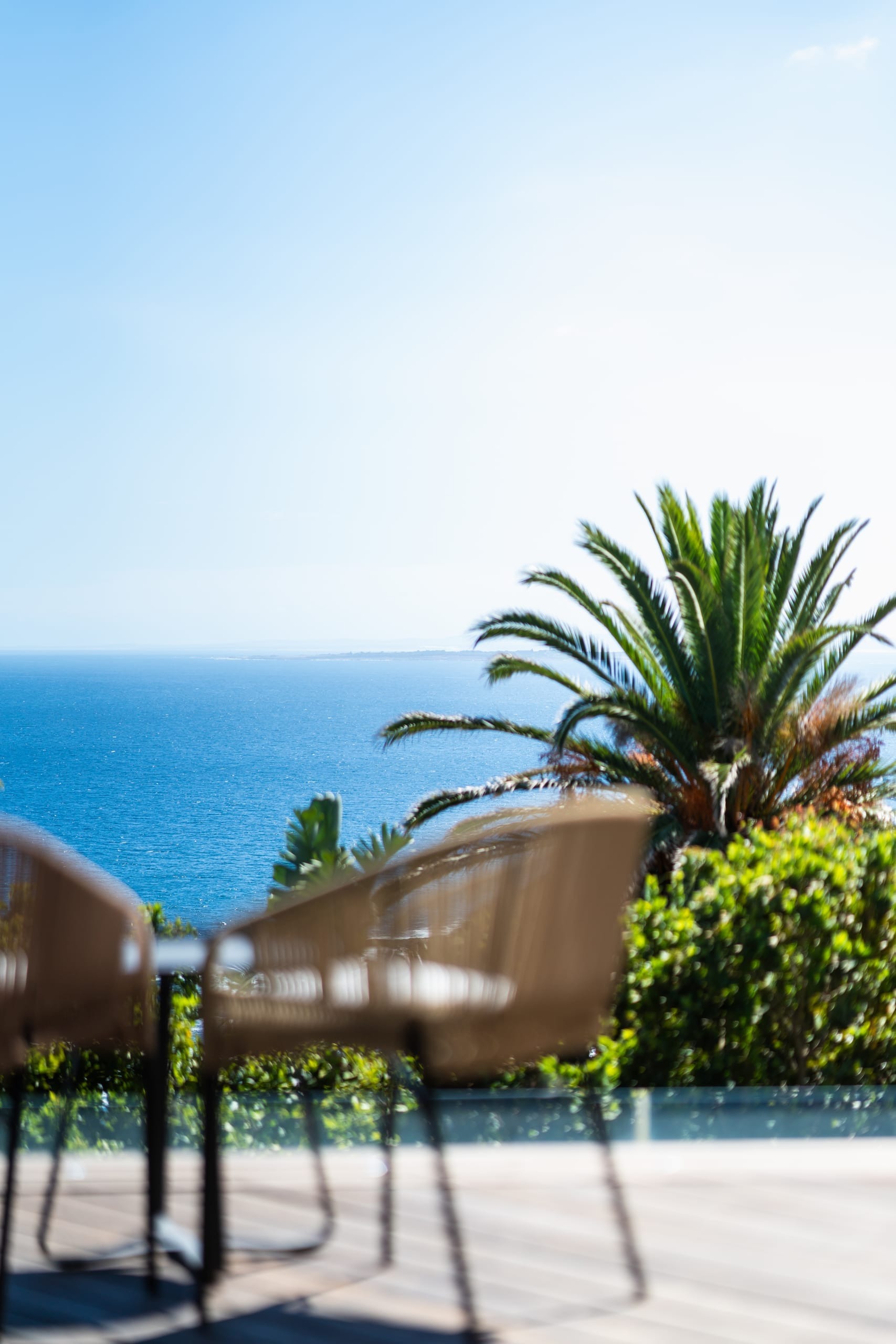 A shaded terrace framing the Atlantic horizon