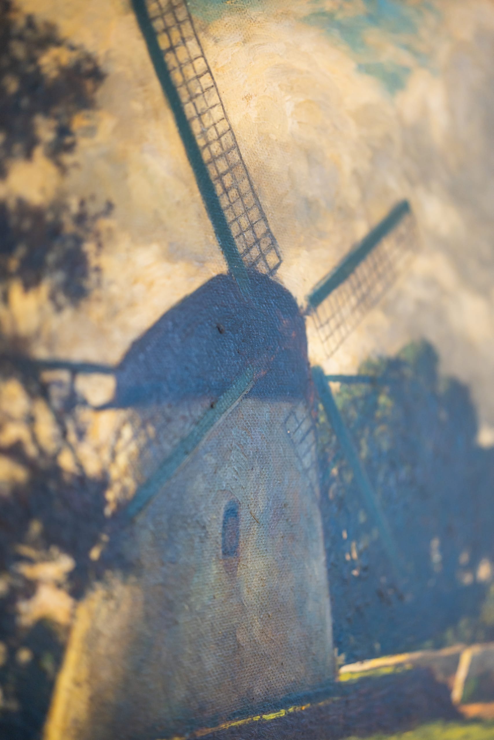 A detail of an impressionist windmill painting
