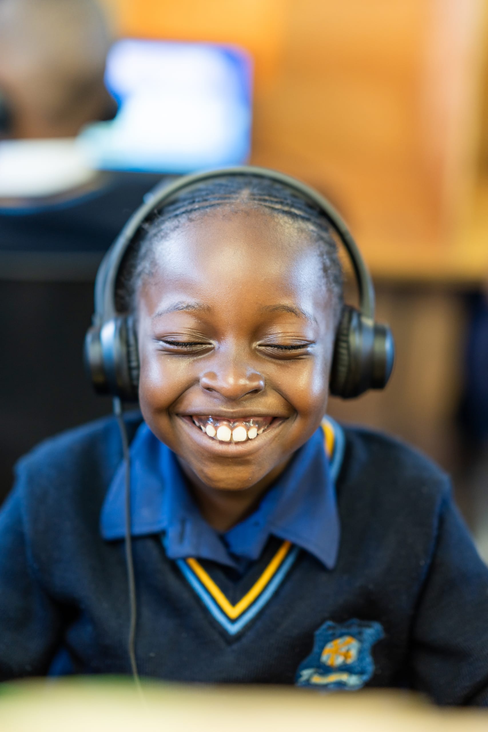 A young learner engaged in a digital learning programme