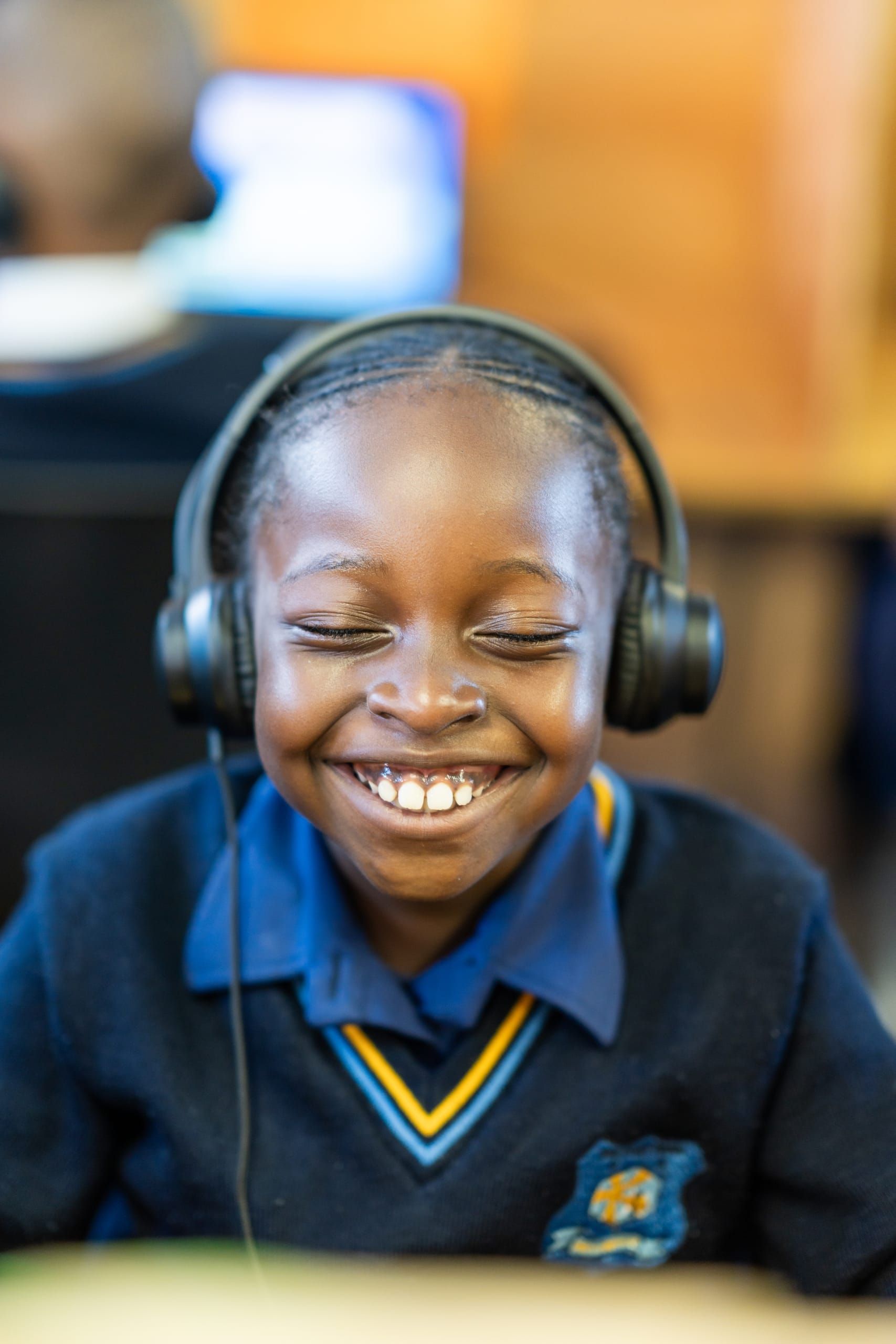 A young learner engaged in a digital learning programme