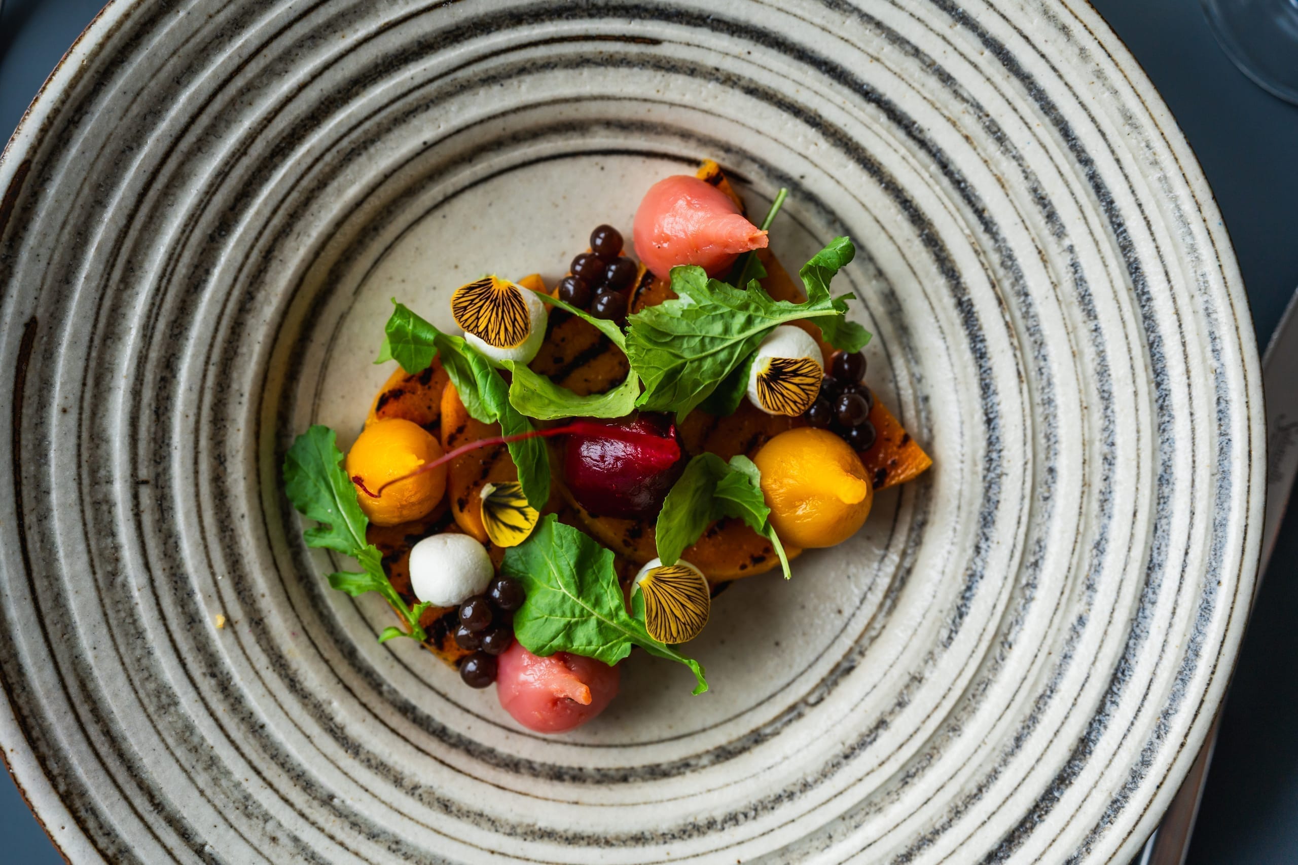 A plated tasting-menu dish