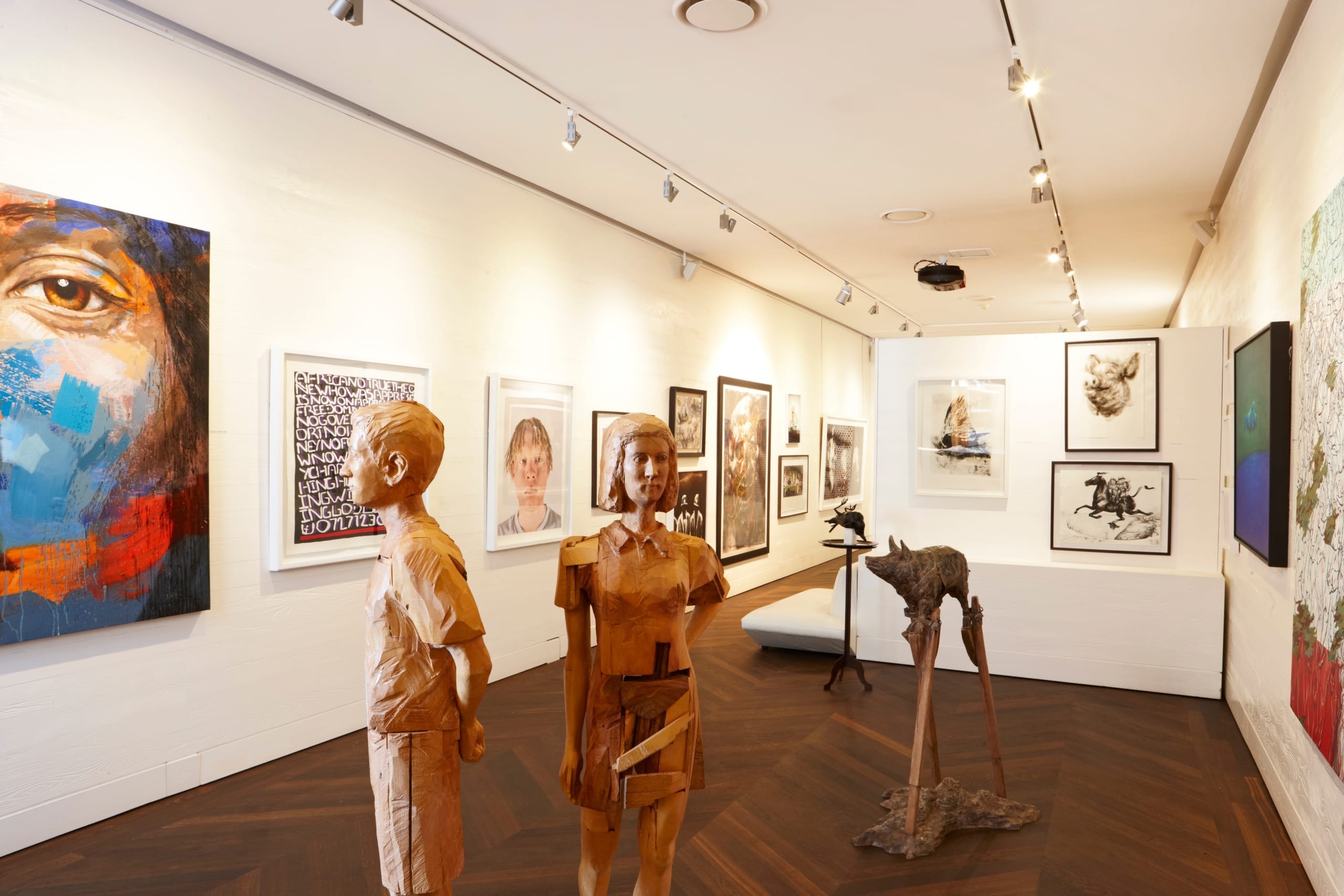The Ellerman House art gallery with paintings hung along a quiet corridor
