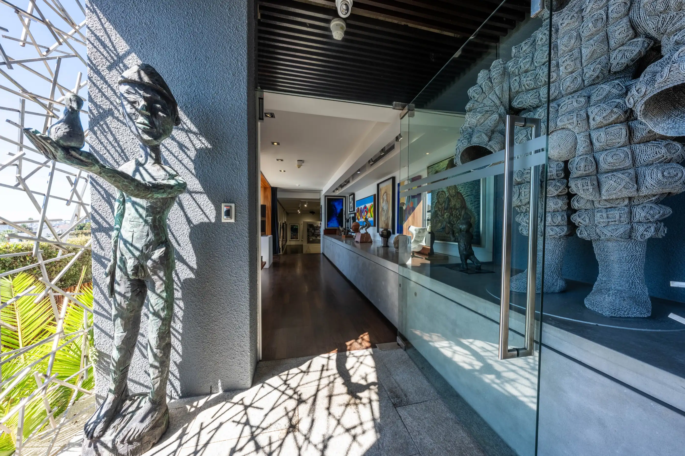 Sculptures lining the art gallery corridor at Ellerman House