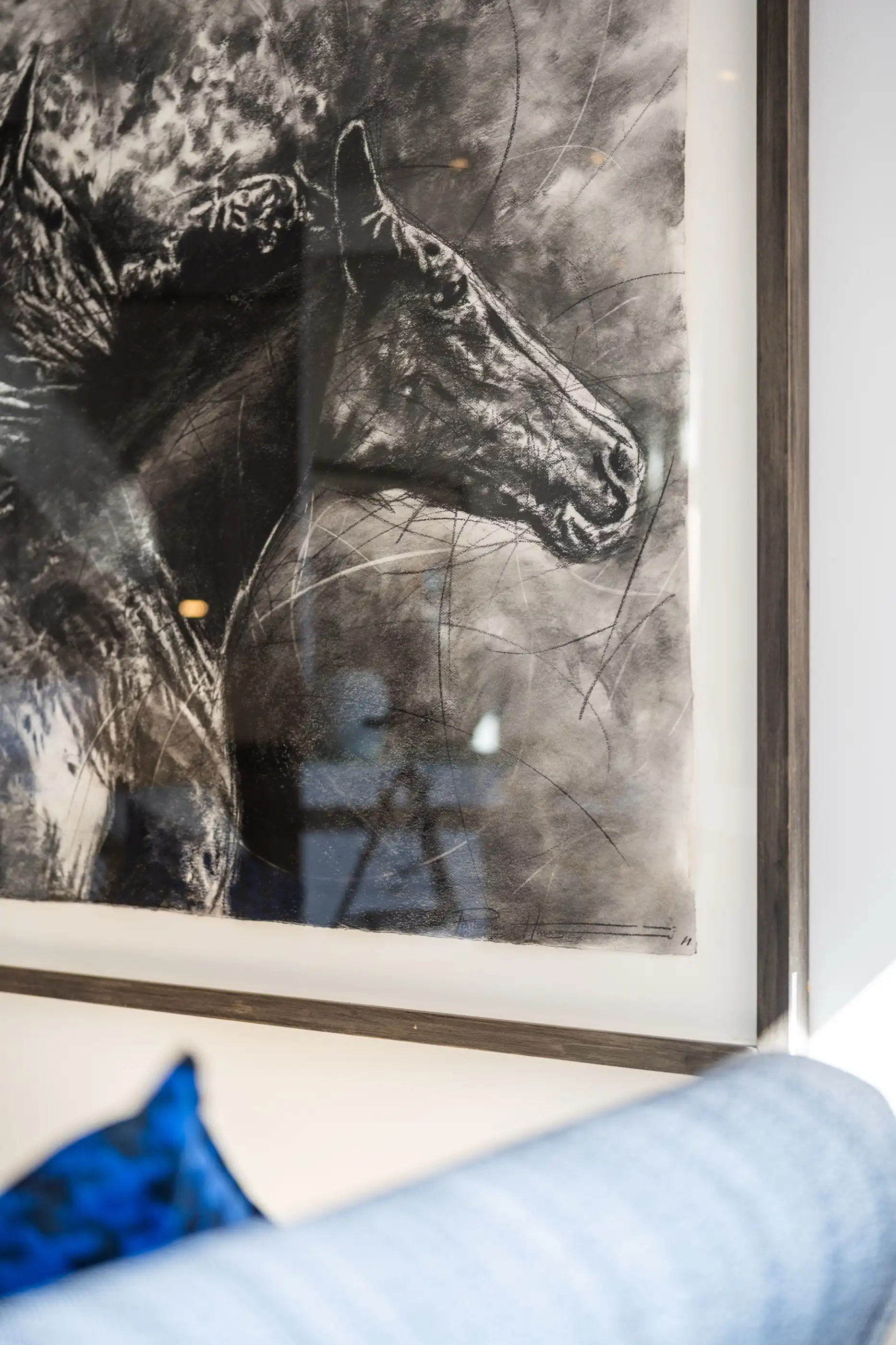 A sketch of a horse hung against panelled wood