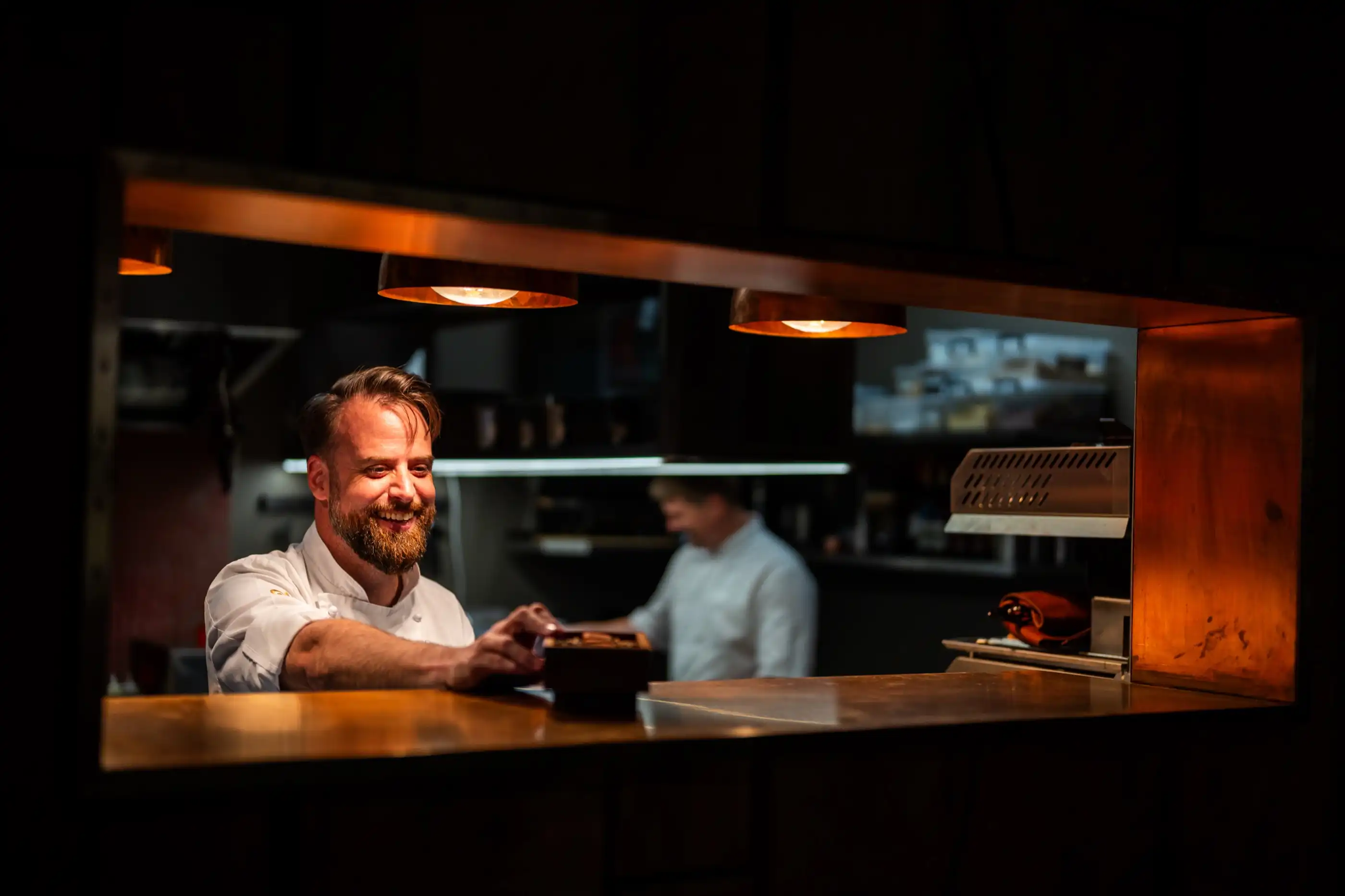 The chef working the pass in the Ellerman House kitchen