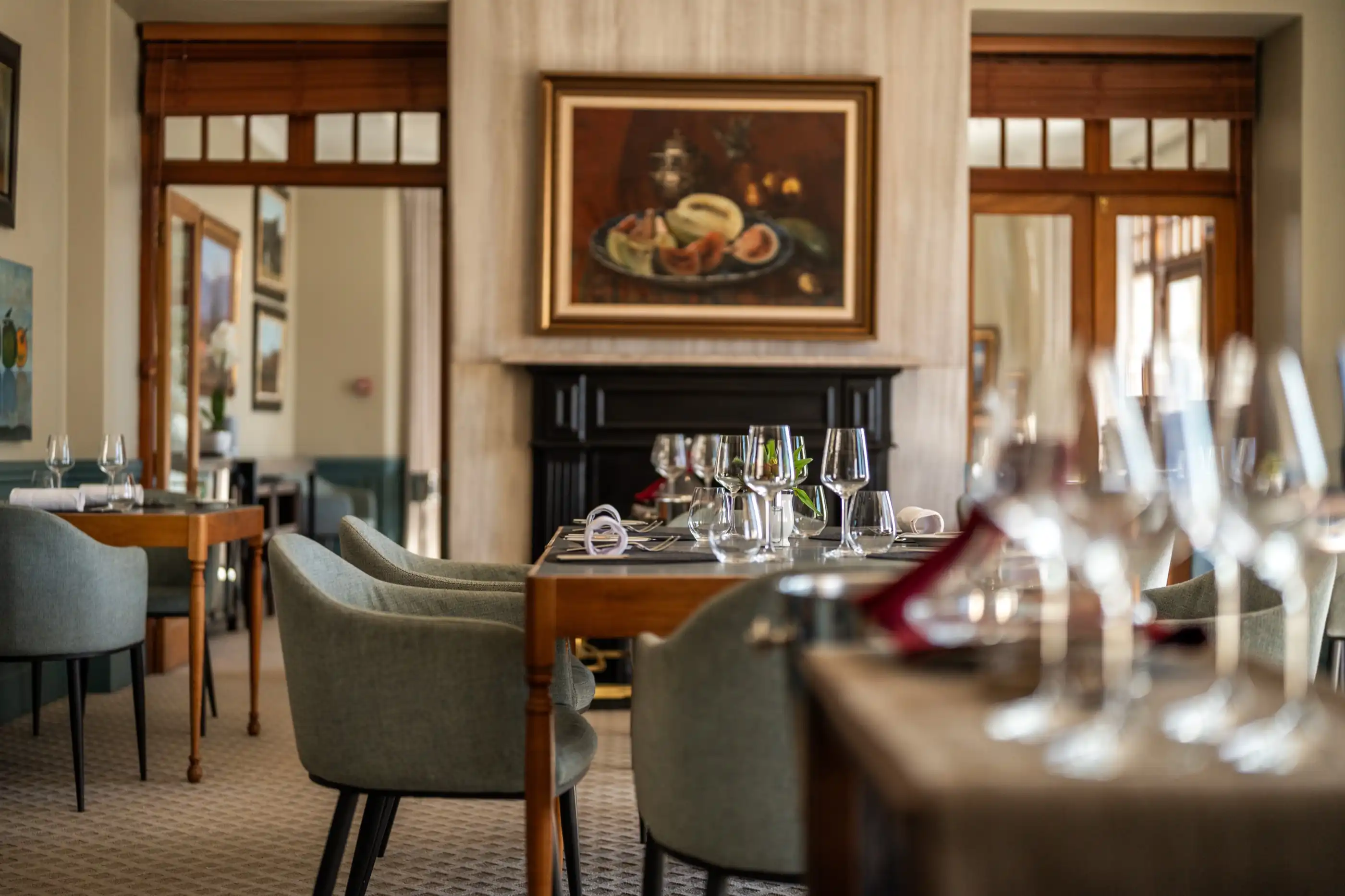 The fireside dining room laid for dinner