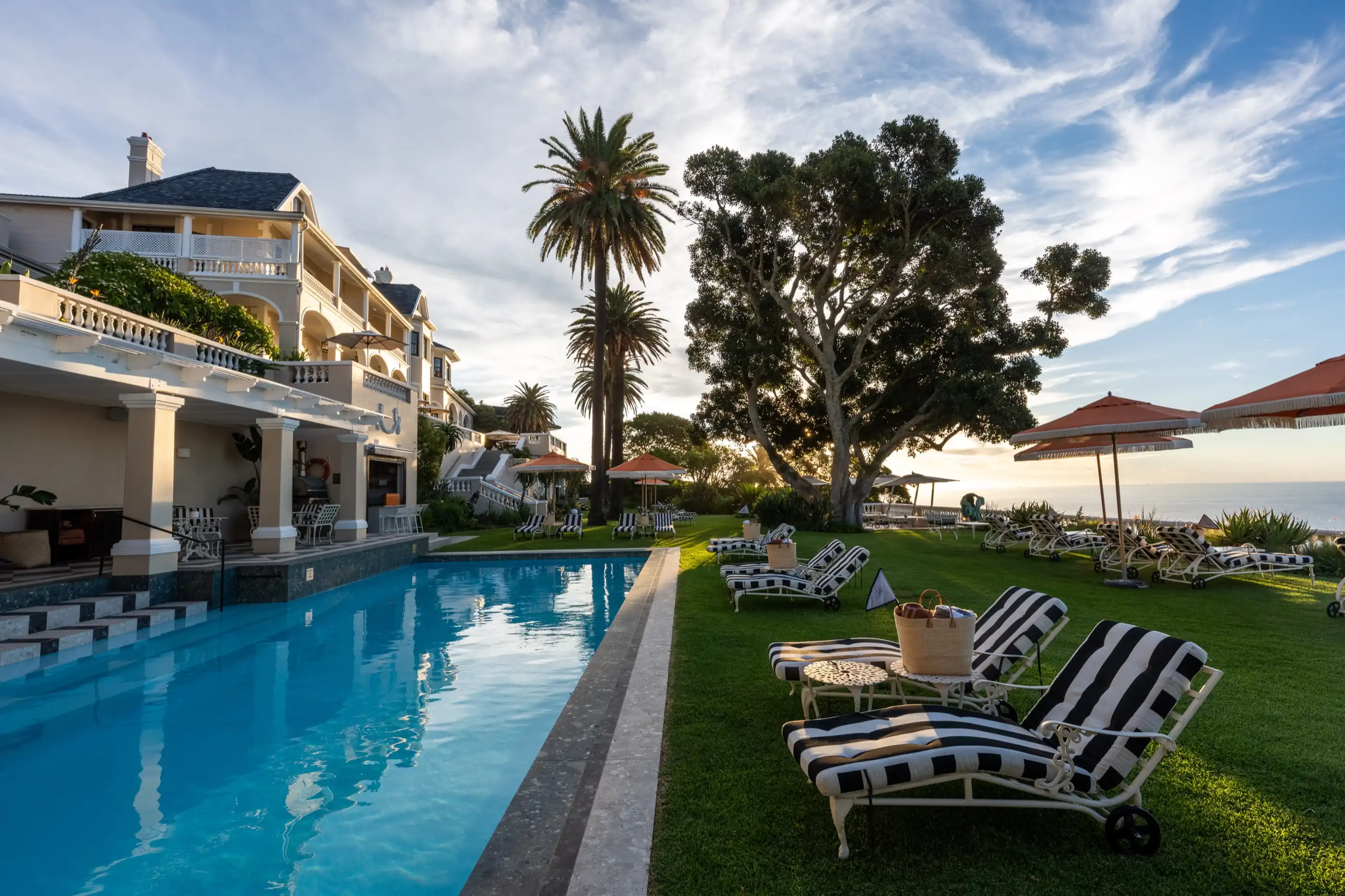 The poolside terrace at sunset above Bantry Bay