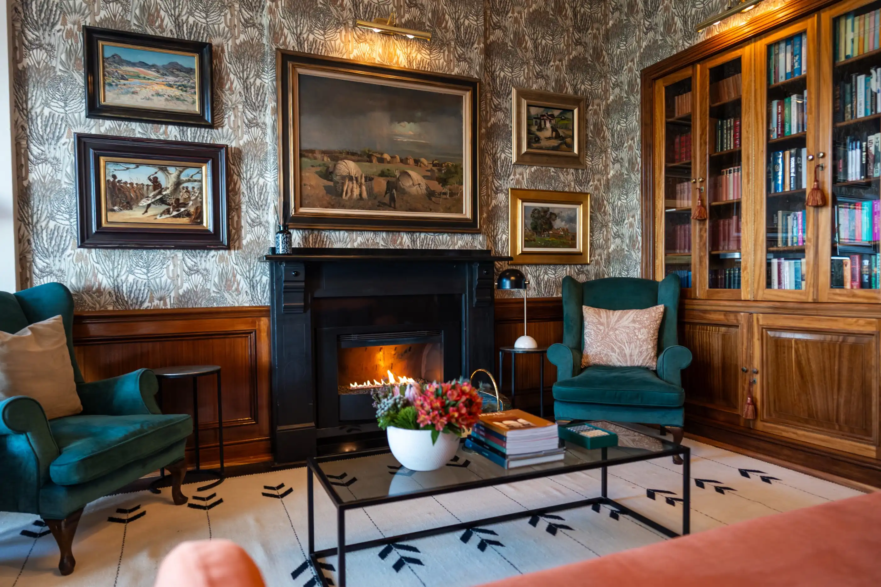 The library lounge with its open fire and book-lined walls