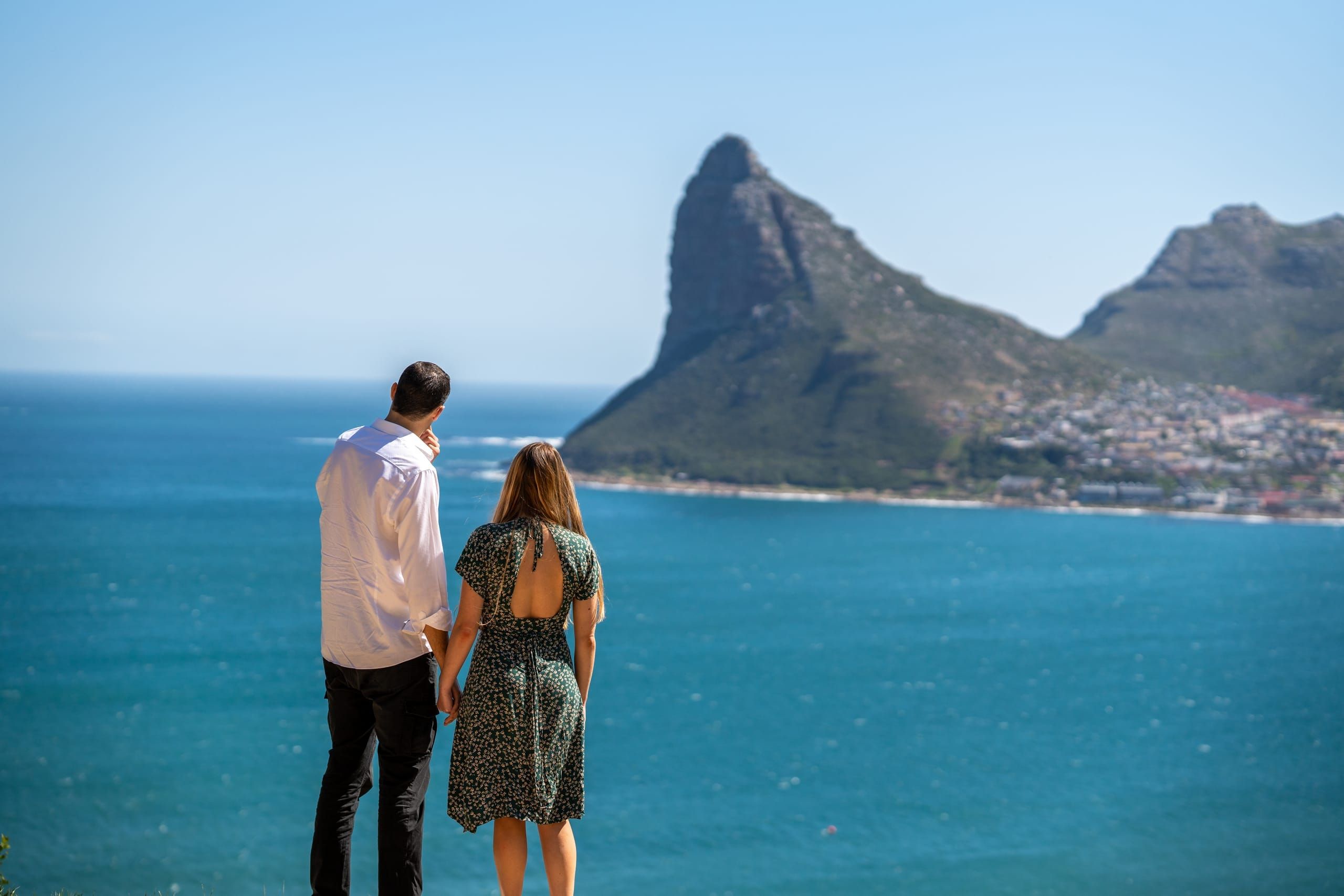 A couple pausing to take in the view over Hout Bay and the peninsula