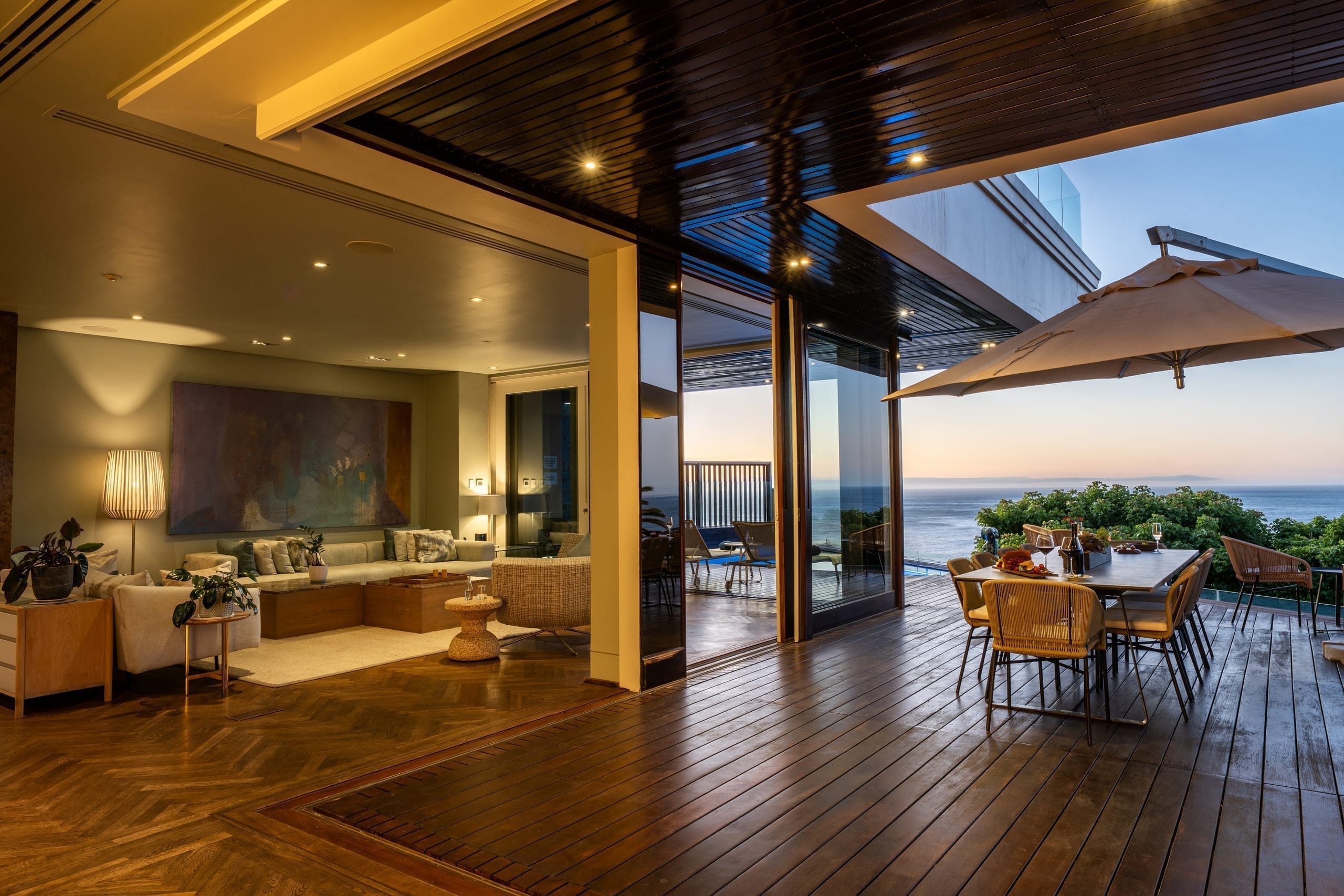 Open-plan villa living space opening to the ocean