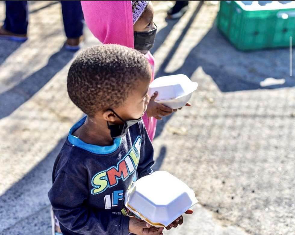 Kids getting their meals while listening to music